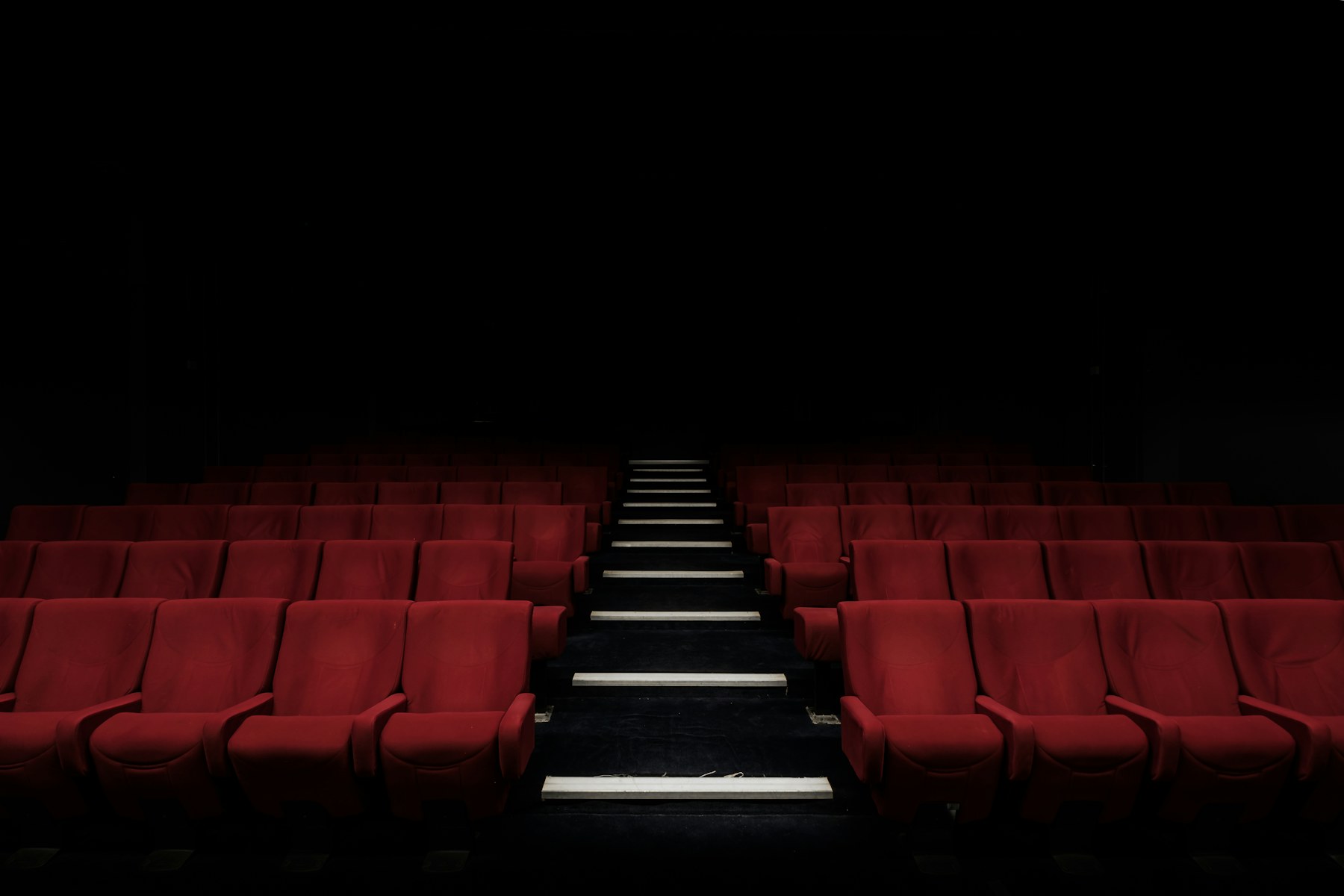 Rows of seats inside a cinema auditorium